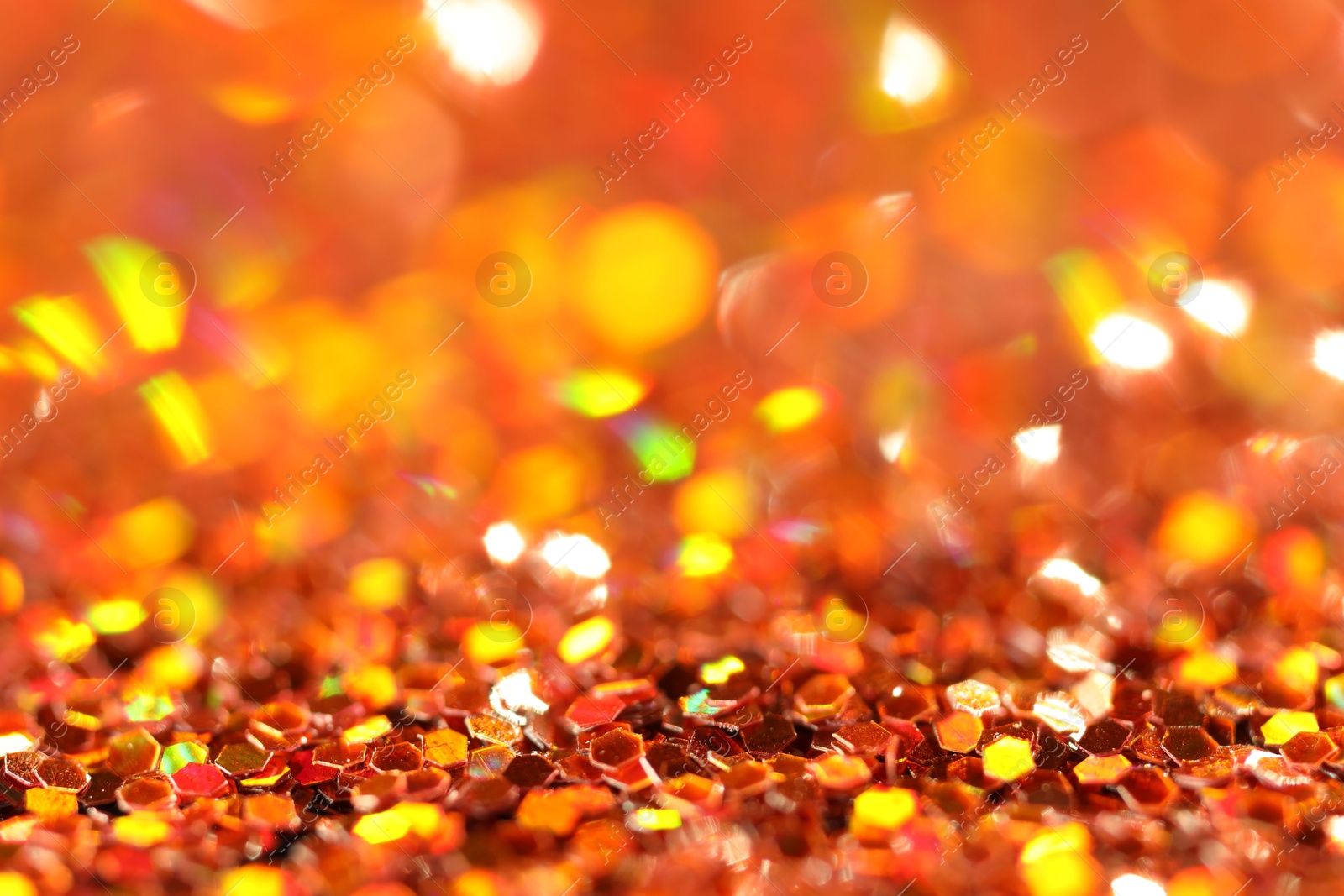 Photo of Beautiful shiny golden glitter as background, closeup