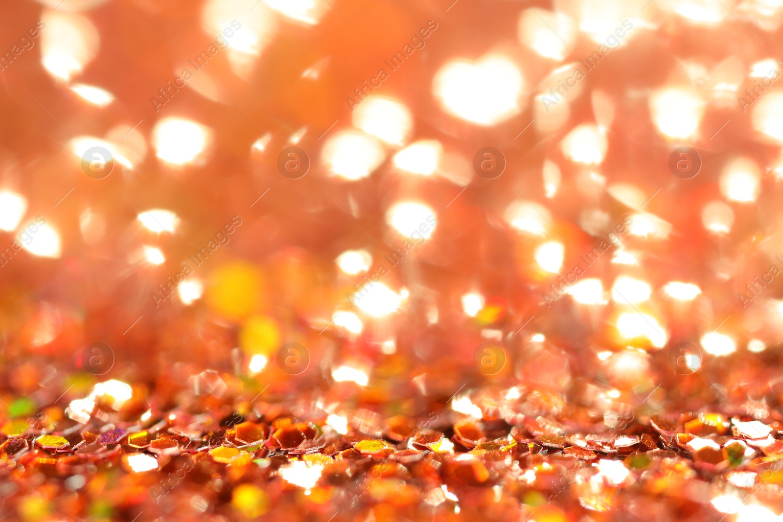 Photo of Beautiful shiny golden glitter as background, closeup