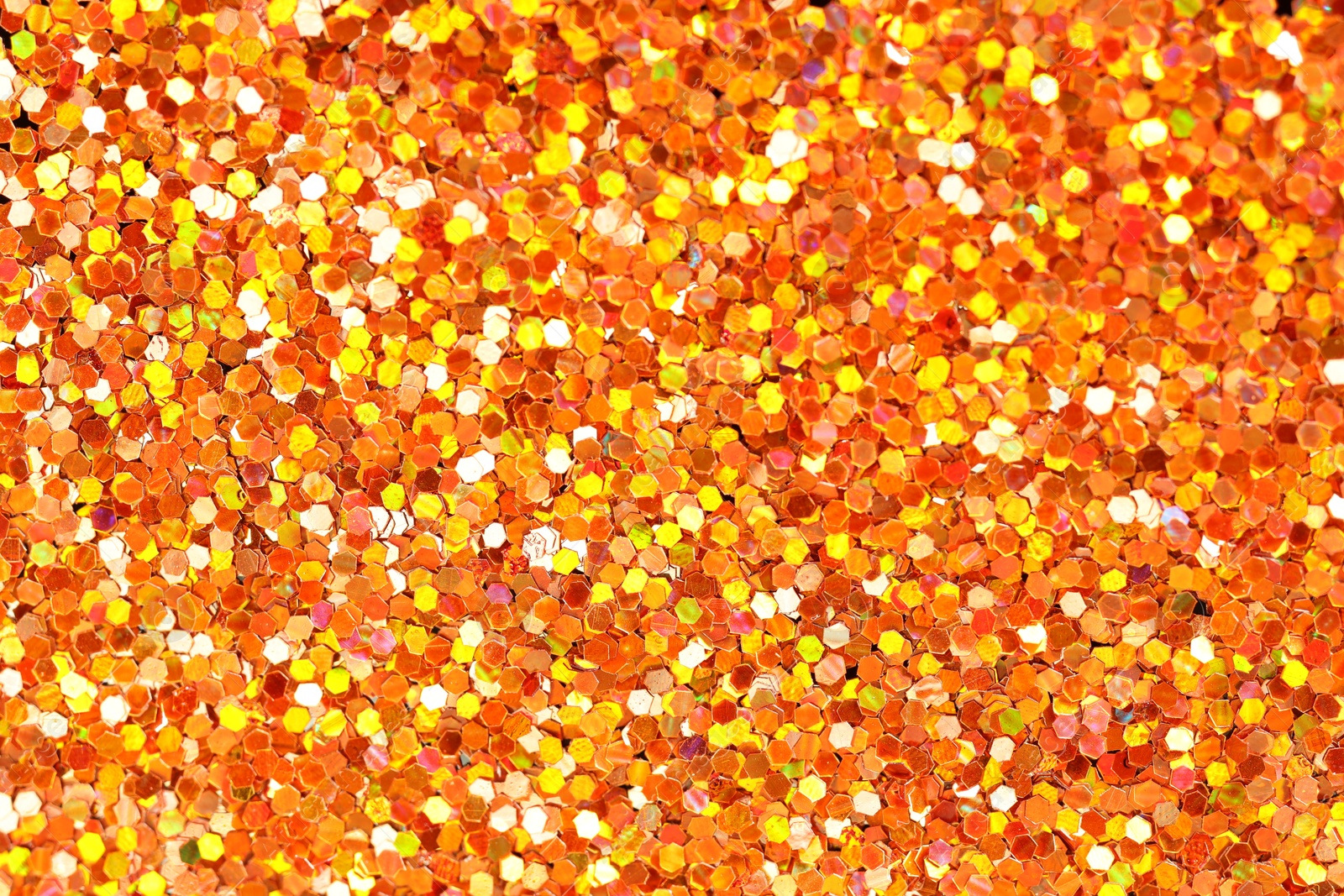 Photo of Beautiful shiny golden glitter as background, top view