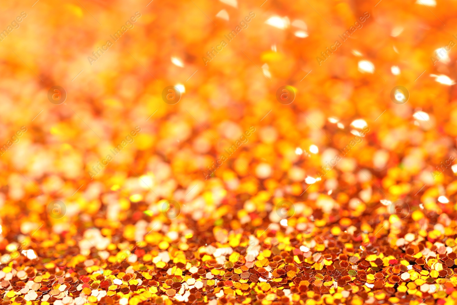 Photo of Beautiful shiny golden glitter as background, closeup