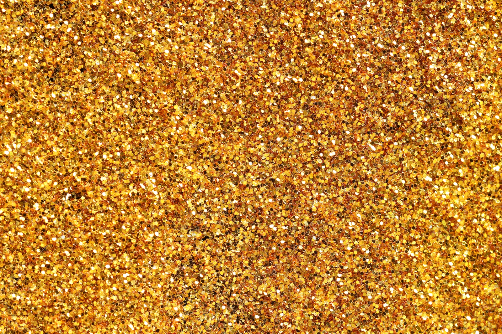 Photo of Beautiful shiny golden glitter as background, top view