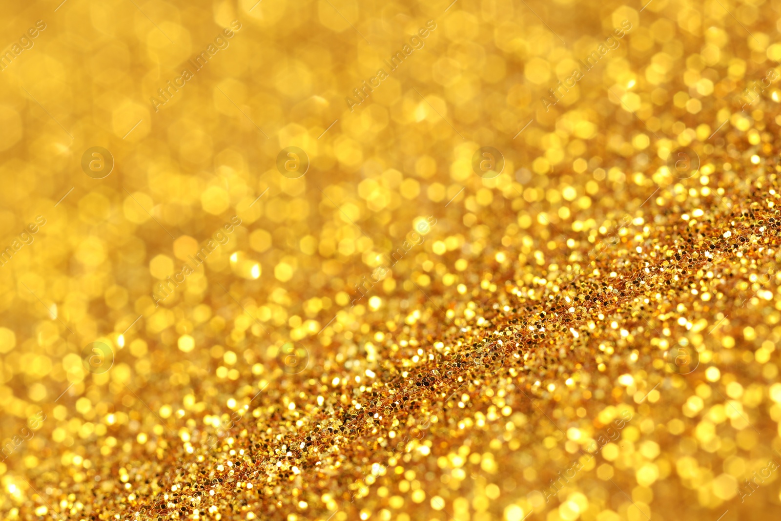 Photo of Beautiful shiny golden glitter as background, closeup