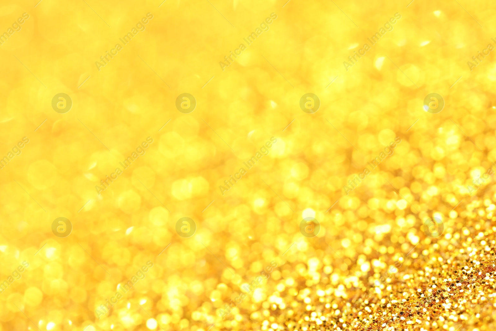 Photo of Beautiful shiny golden glitter as background, closeup