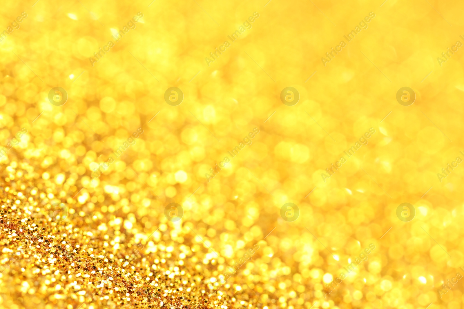 Photo of Beautiful shiny golden glitter as background, closeup