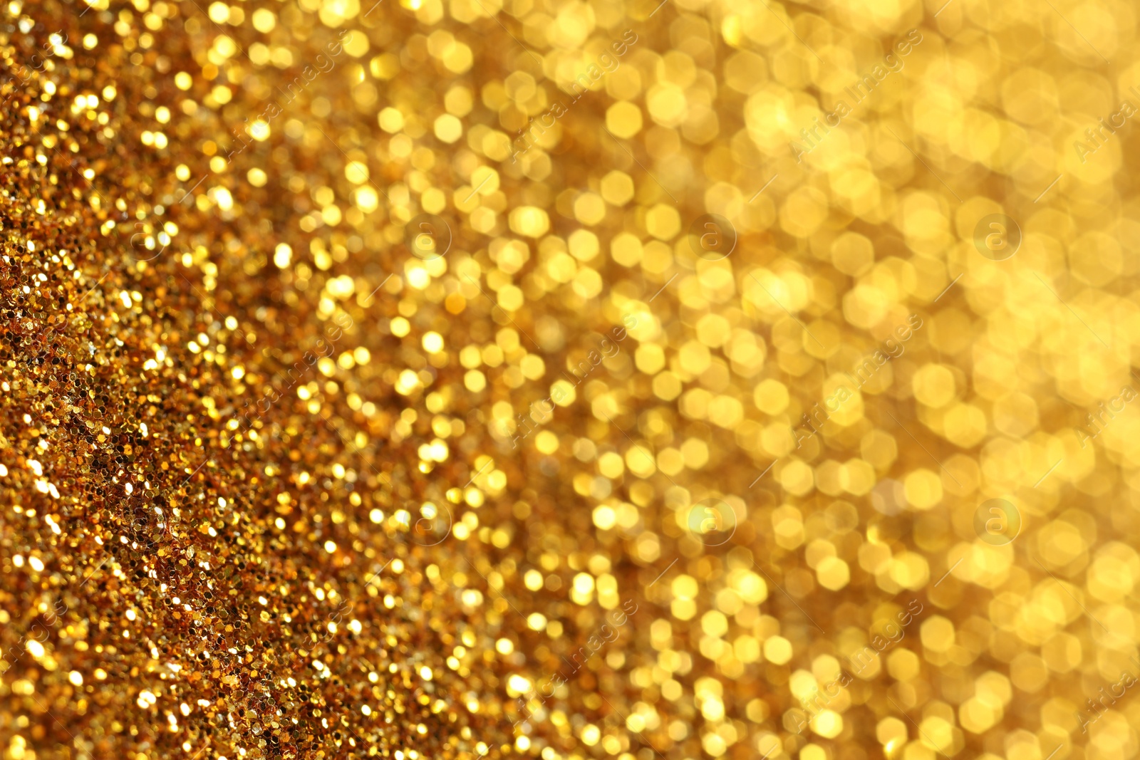 Photo of Beautiful shiny golden glitter as background, closeup