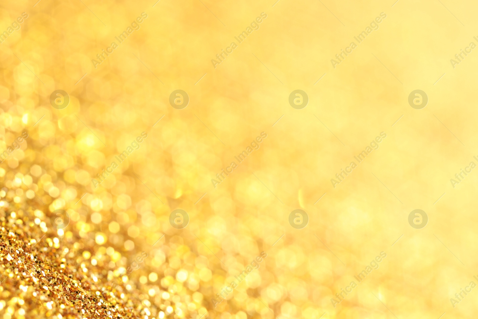 Photo of Beautiful shiny golden glitter as background, closeup