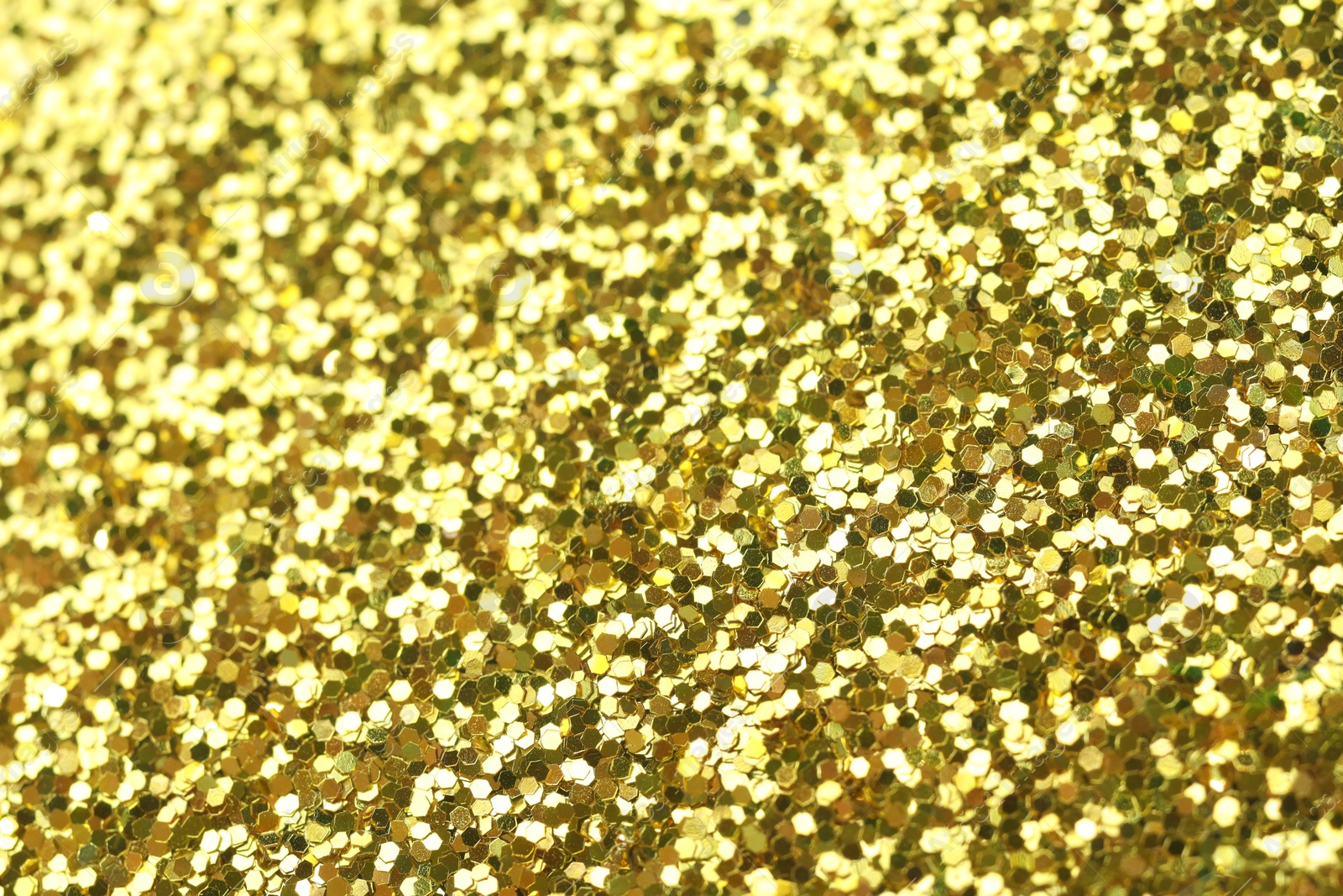 Photo of Beautiful shiny golden glitter as background, top view