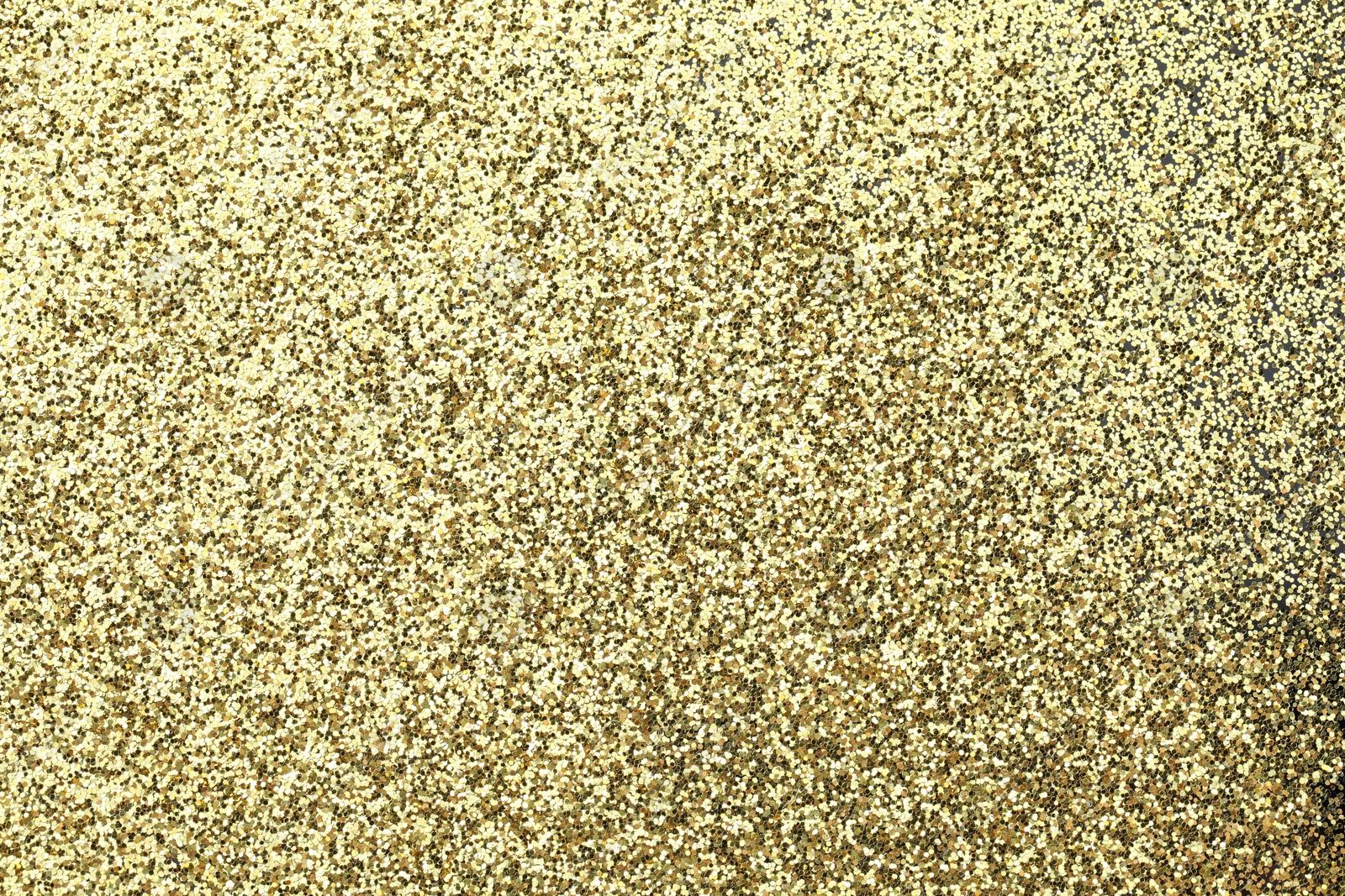 Photo of Beautiful shiny golden glitter as background, top view