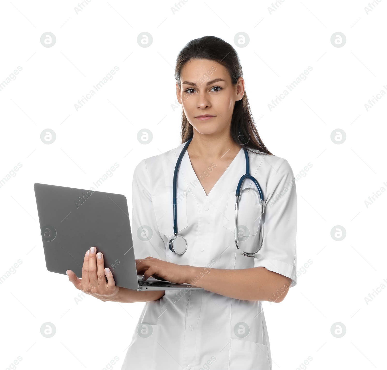 Photo of Portrait of beautiful nurse with laptop on white background