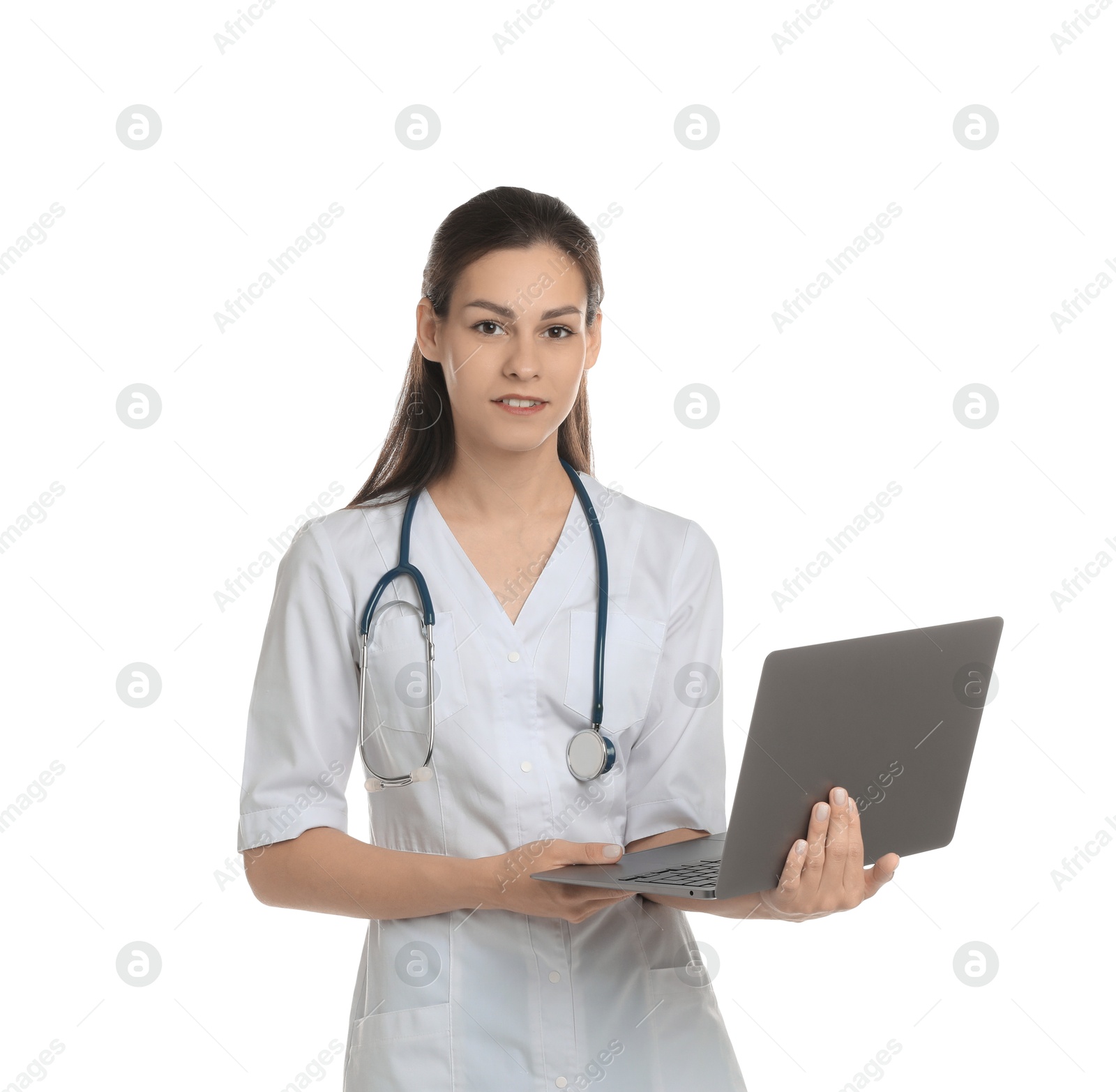 Photo of Portrait of beautiful nurse with laptop on white background