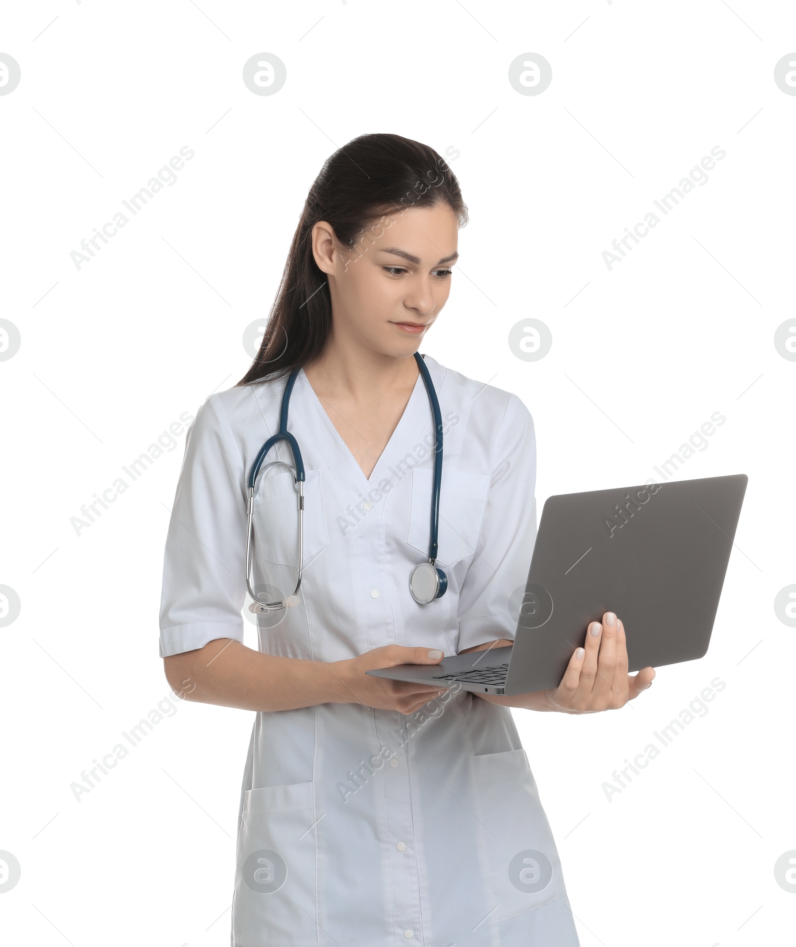 Photo of Portrait of beautiful nurse with laptop on white background