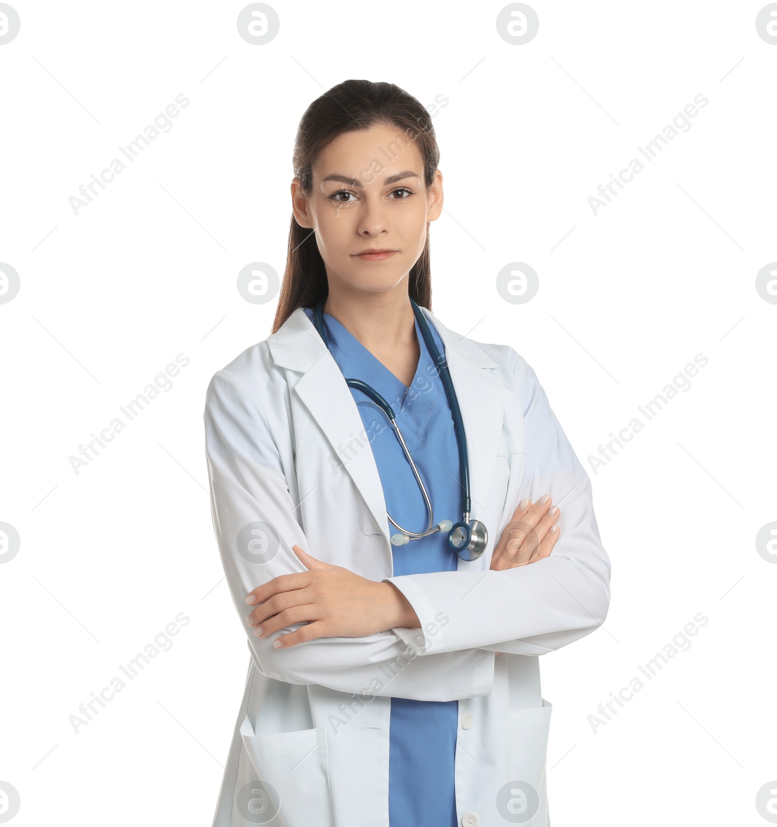 Photo of Portrait of beautiful nurse with crossed arms on white background