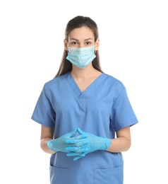 Beautiful nurse in medical mask and gloves on white background