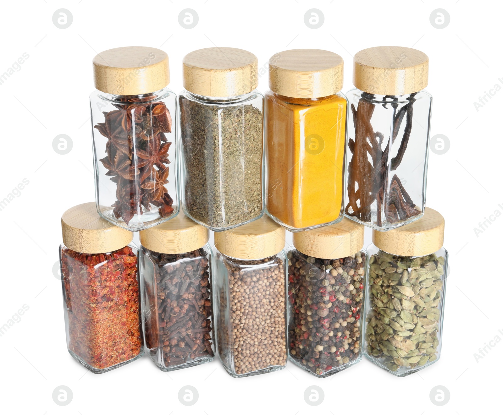 Photo of Different spices in glass jars isolated on white