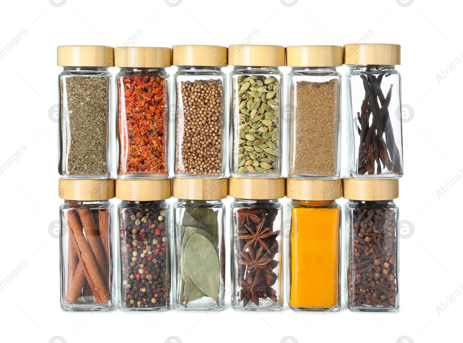 Photo of Different spices in glass jars isolated on white