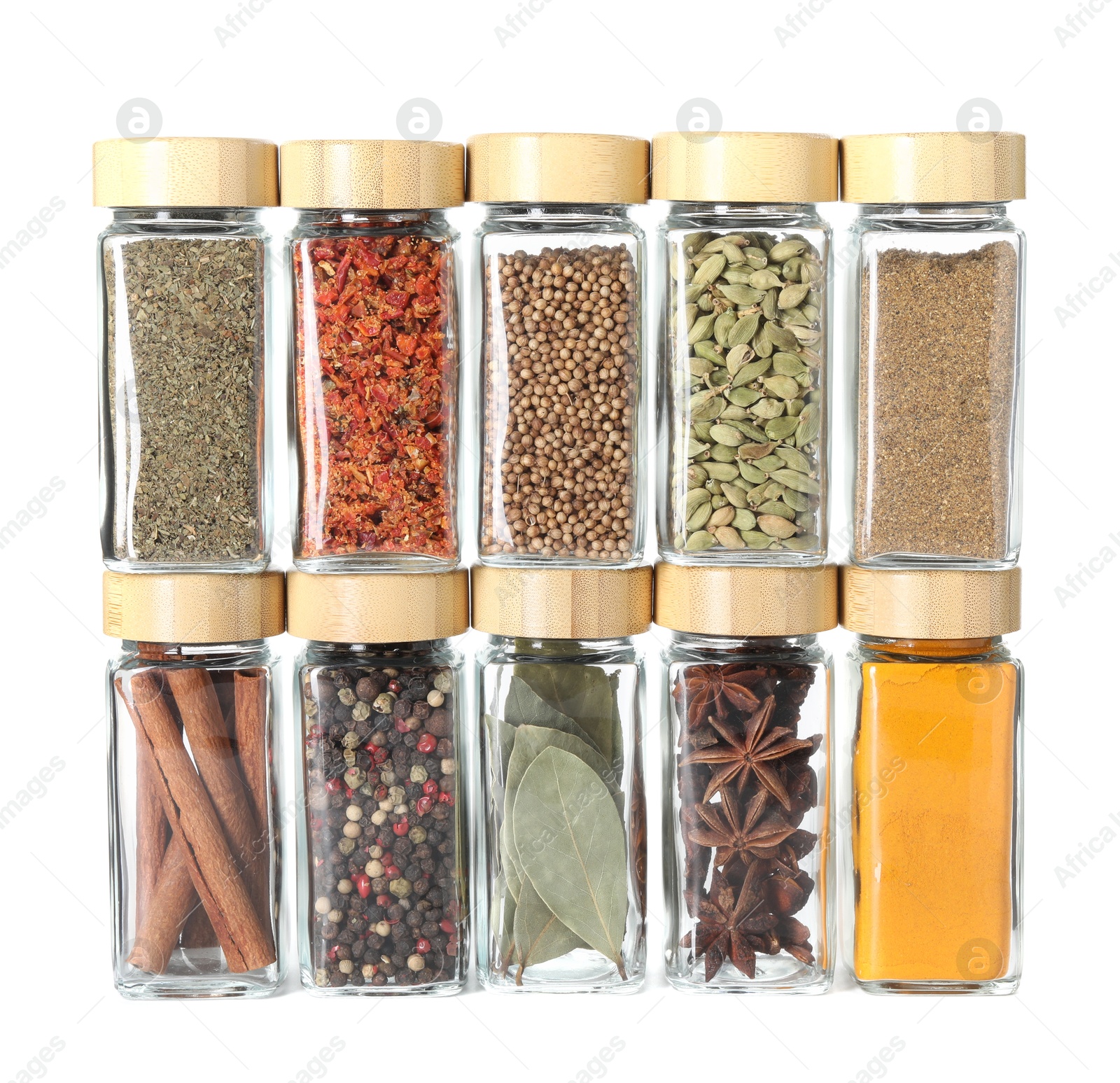 Photo of Different spices in glass jars isolated on white