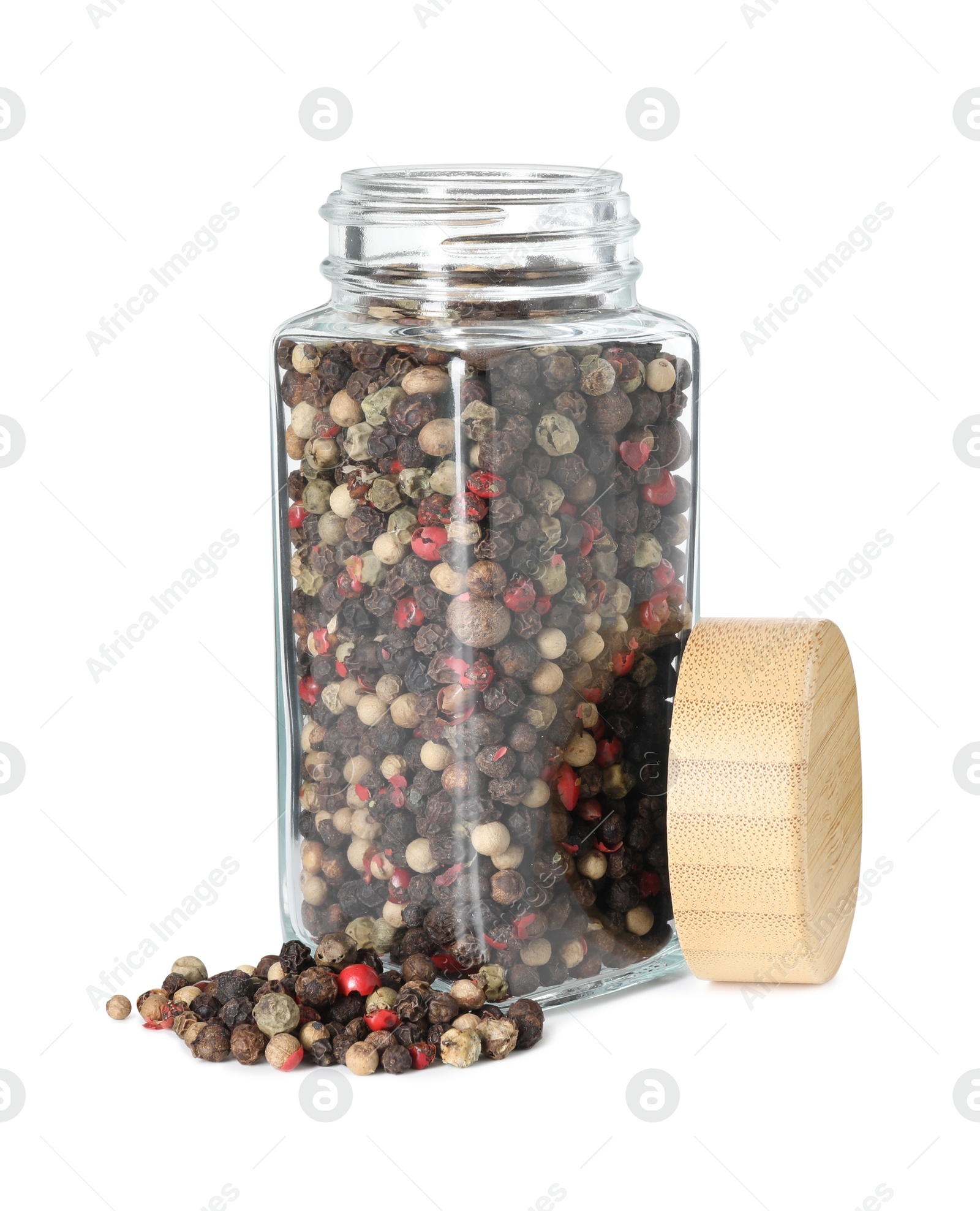 Photo of Peppercorns in glass jar isolated on white