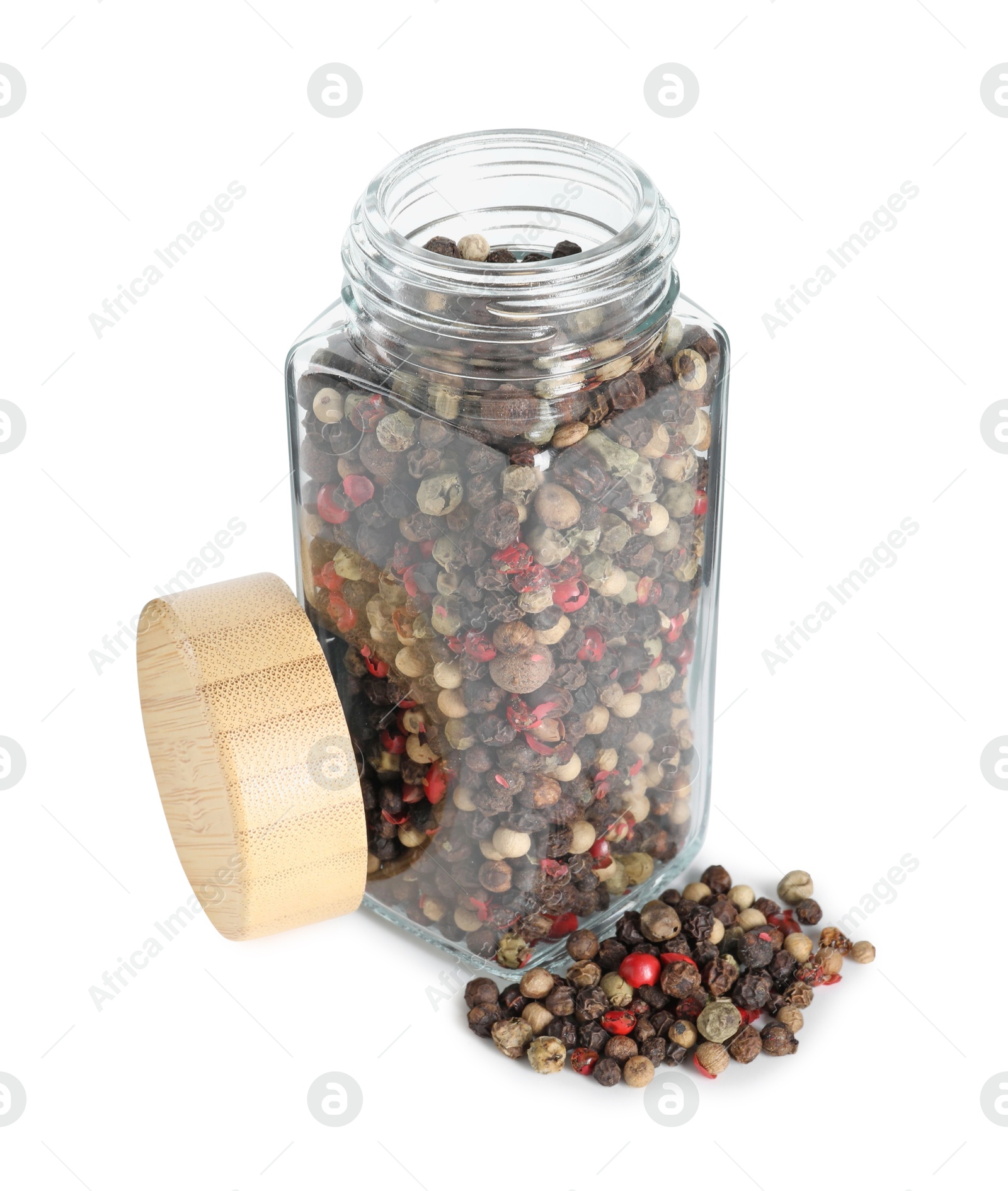 Photo of Peppercorns in glass jar isolated on white