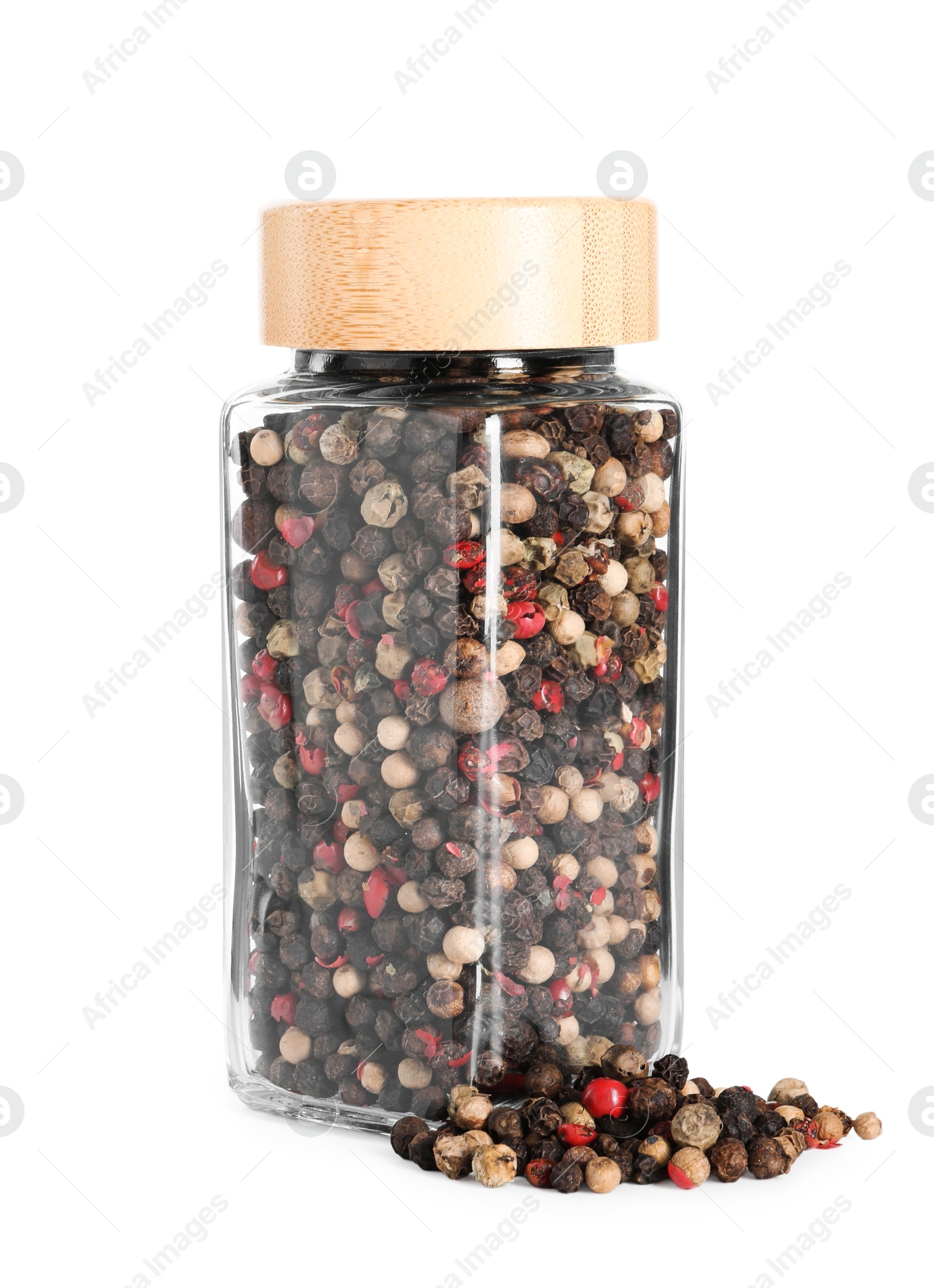 Photo of Peppercorns in glass jar isolated on white