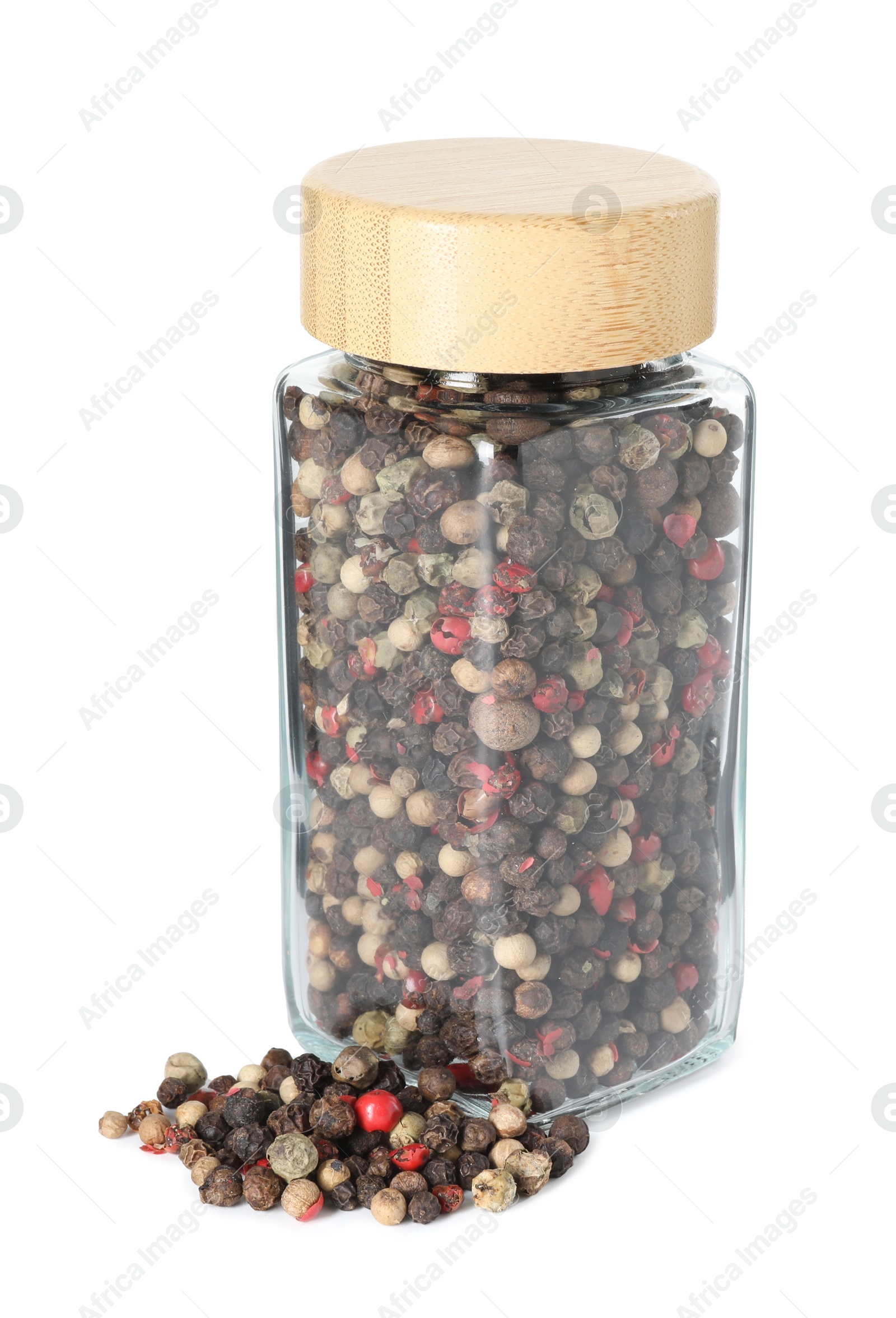 Photo of Peppercorns in glass jar isolated on white