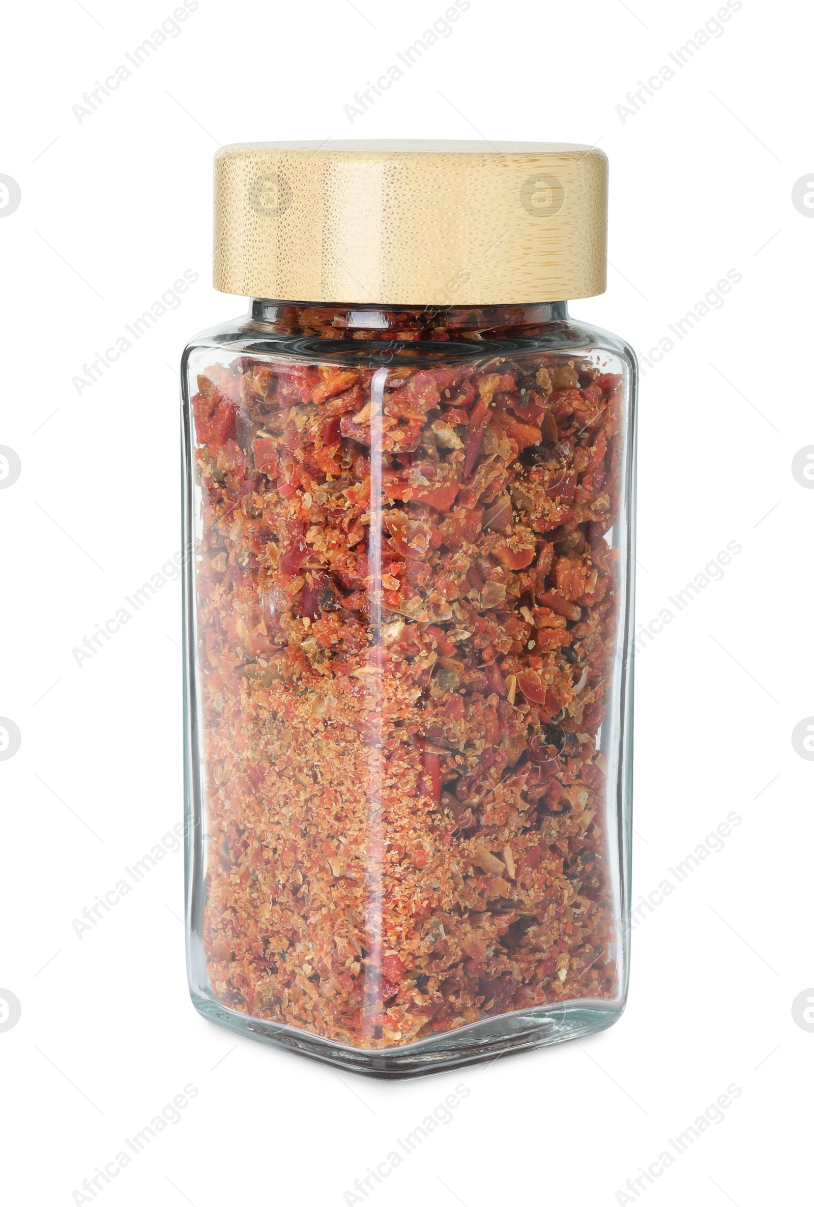 Photo of Red chili pepper flakes in glass jar isolated on white