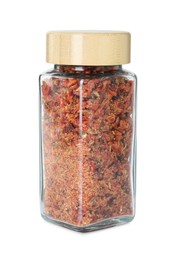 Photo of Red chili pepper flakes in glass jar isolated on white