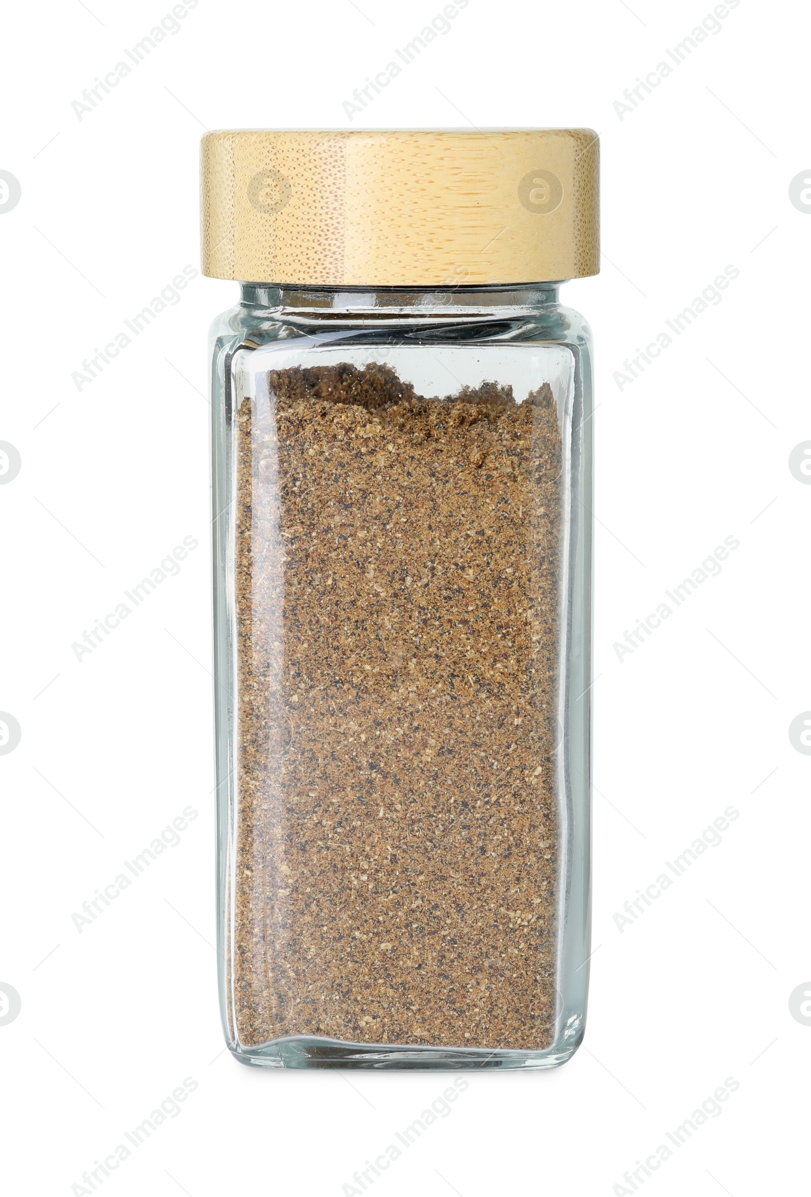 Photo of Cumin powder in glass jar isolated on white