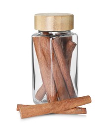 Photo of Cinnamon sticks in glass jar isolated on white