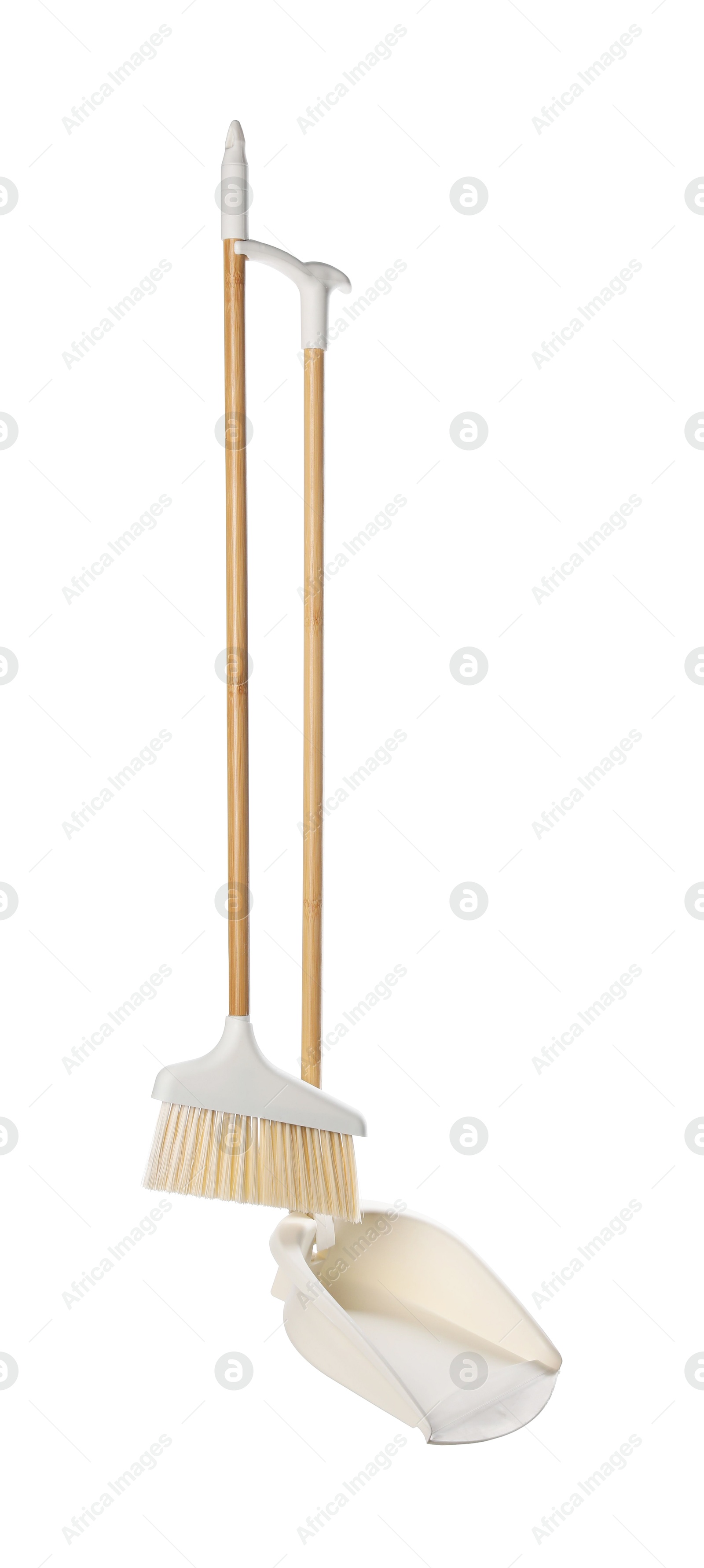 Photo of Broom and dustpan isolated on white. Cleaning tools