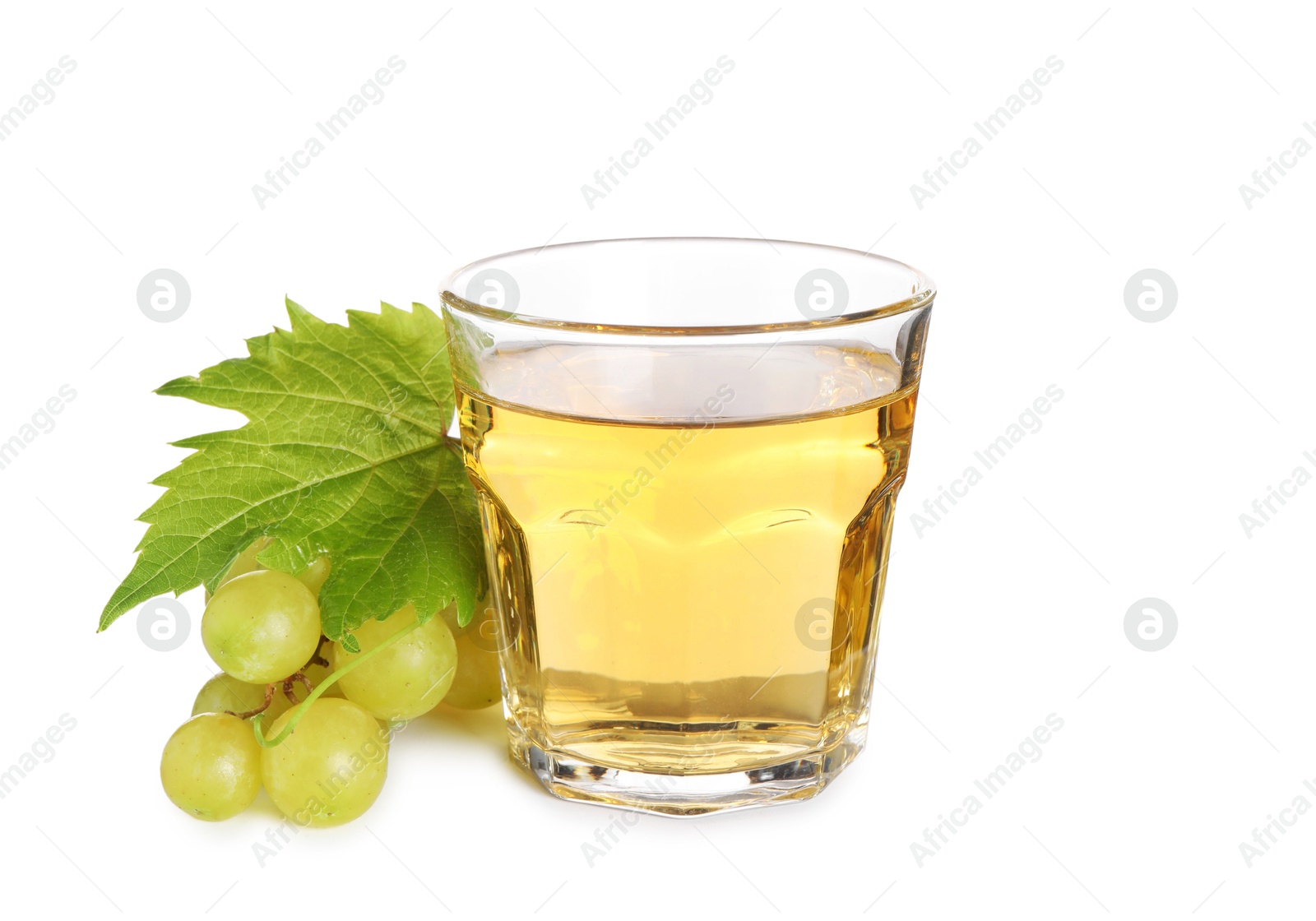 Photo of Ripe grapes and glass of tasty juice isolated on white