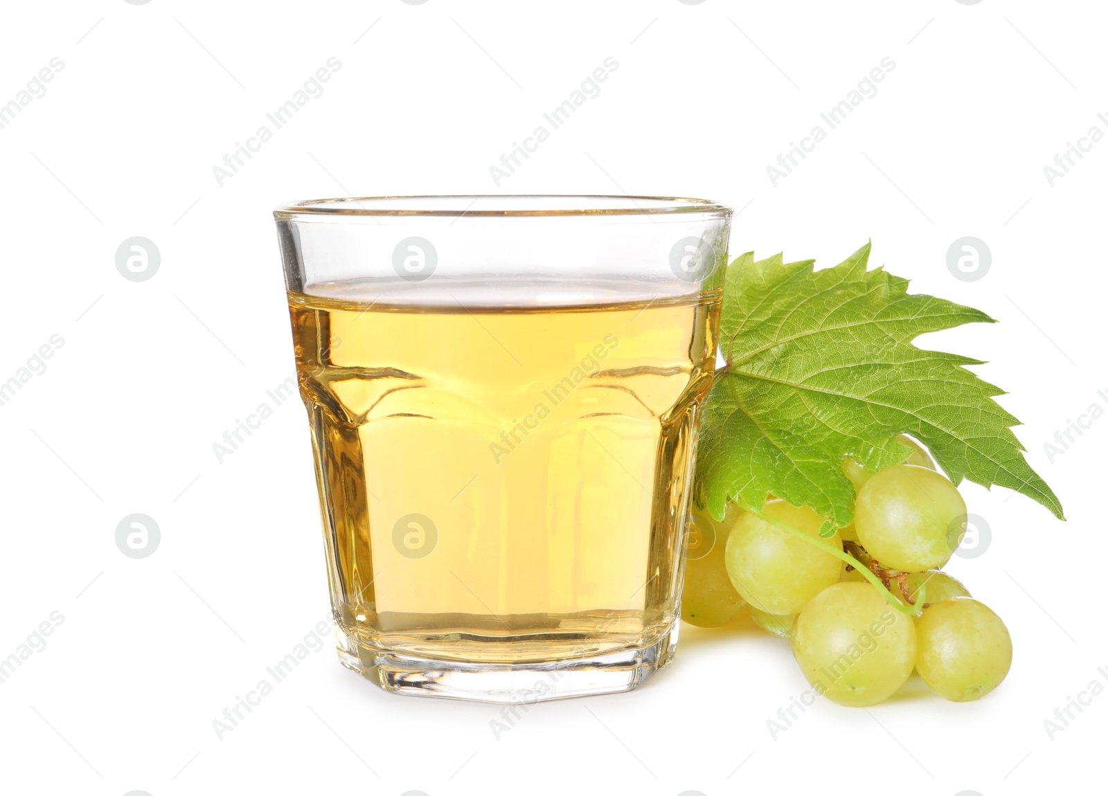 Photo of Ripe grapes and glass of tasty juice isolated on white