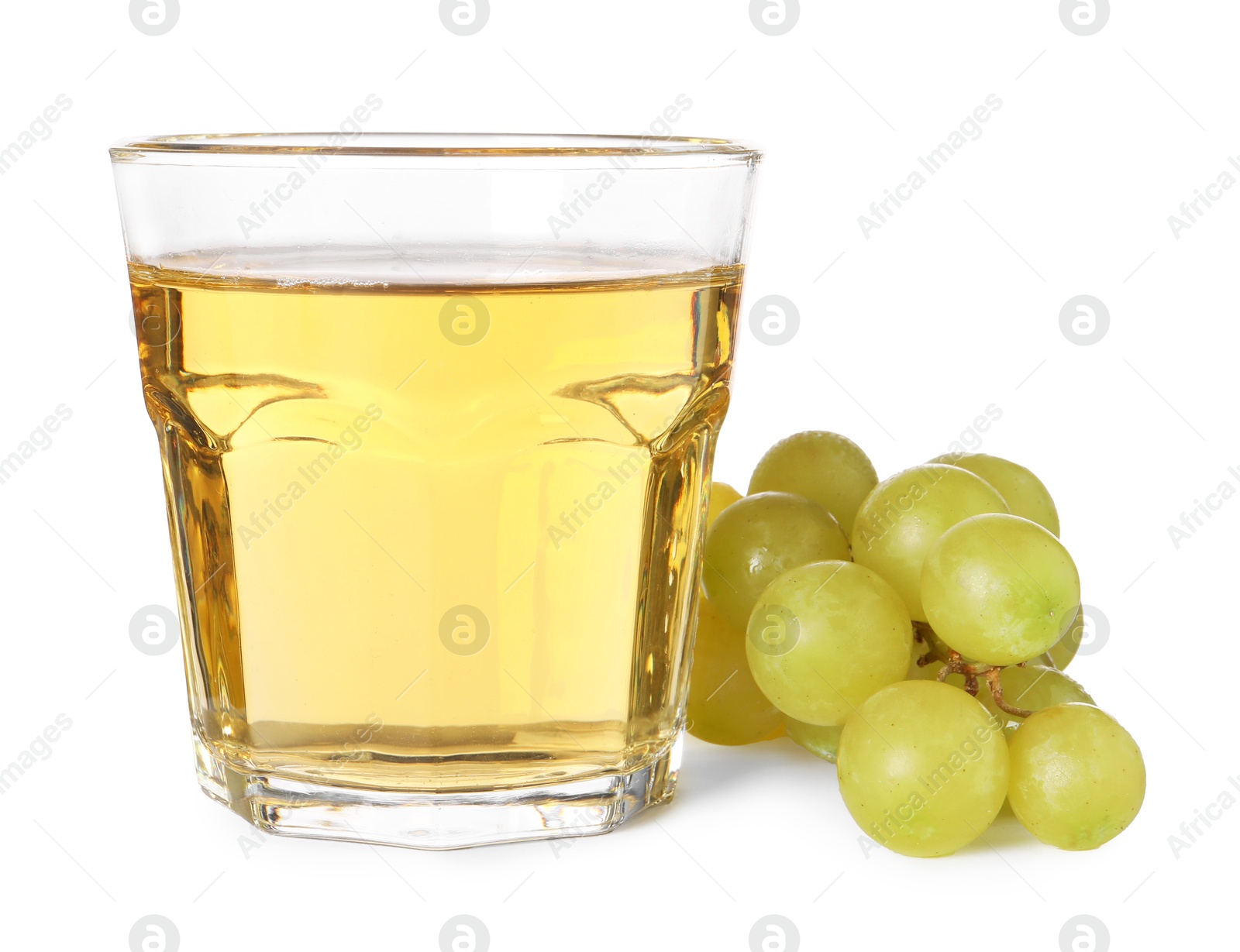 Photo of Ripe grapes and glass of tasty juice isolated on white