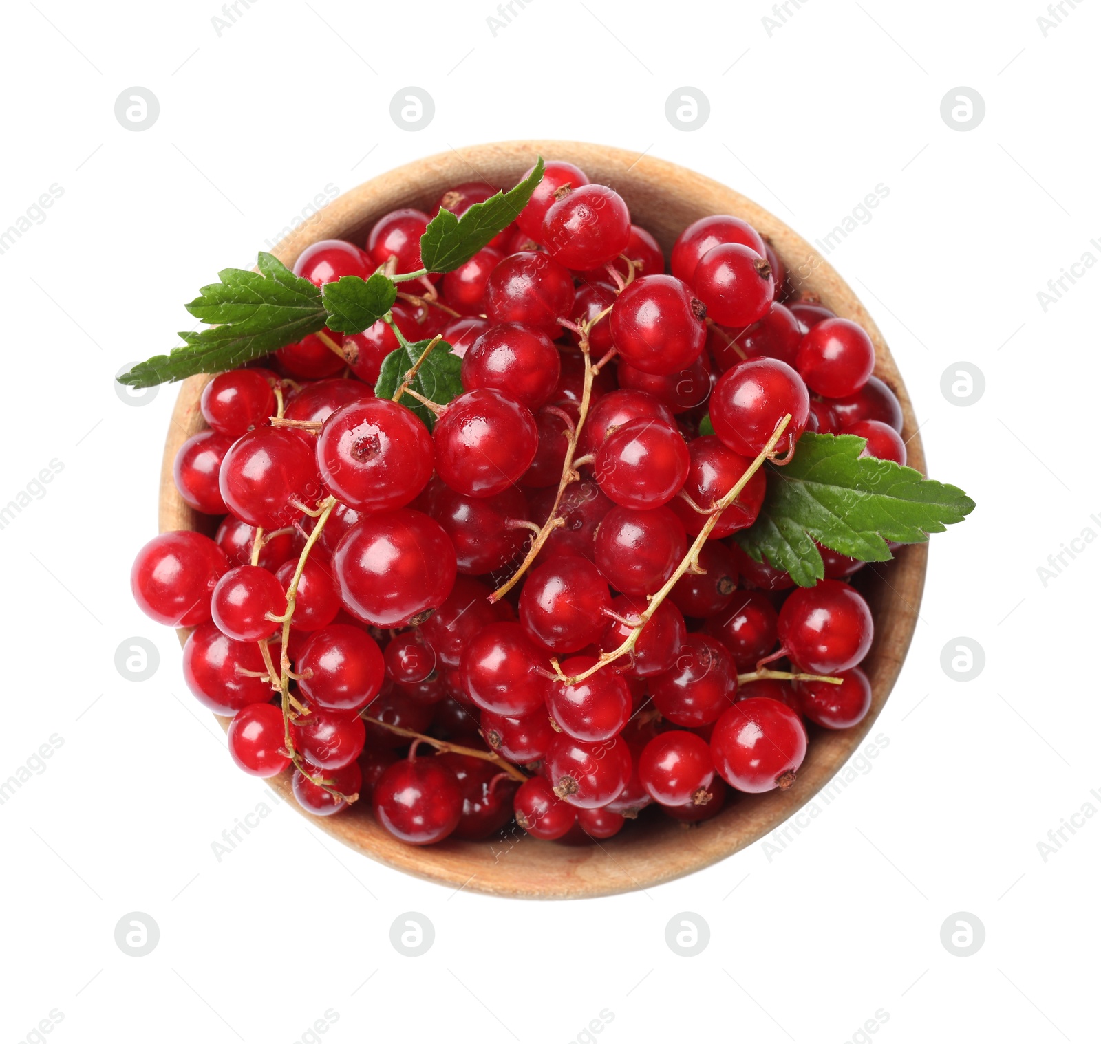 Photo of Ripe red currants with green leaves in bowl isolated on white, top view