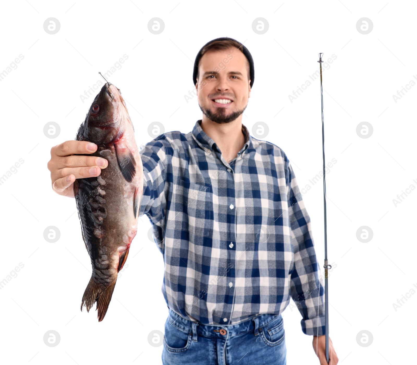 Photo of Smiling fisherman with rod and caught fish isolated on white, selective focus