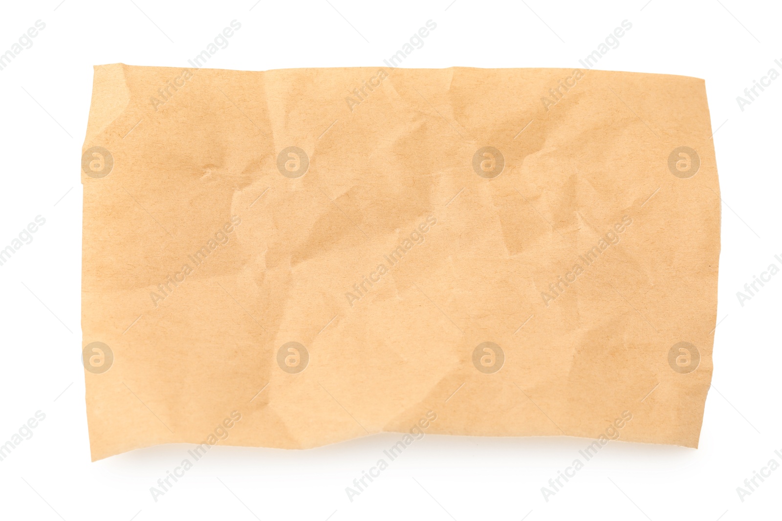 Photo of Crumpled kraft paper sheet isolated on white, top view