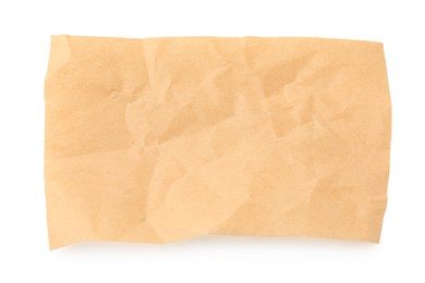 Photo of Crumpled kraft paper sheet isolated on white, top view