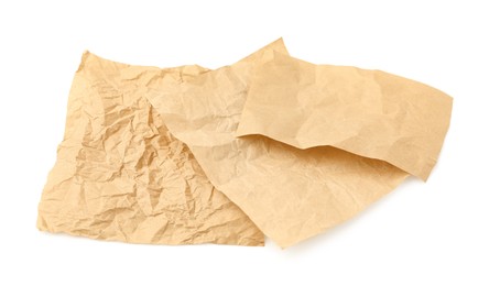 Photo of Crumpled kraft paper sheets isolated on white