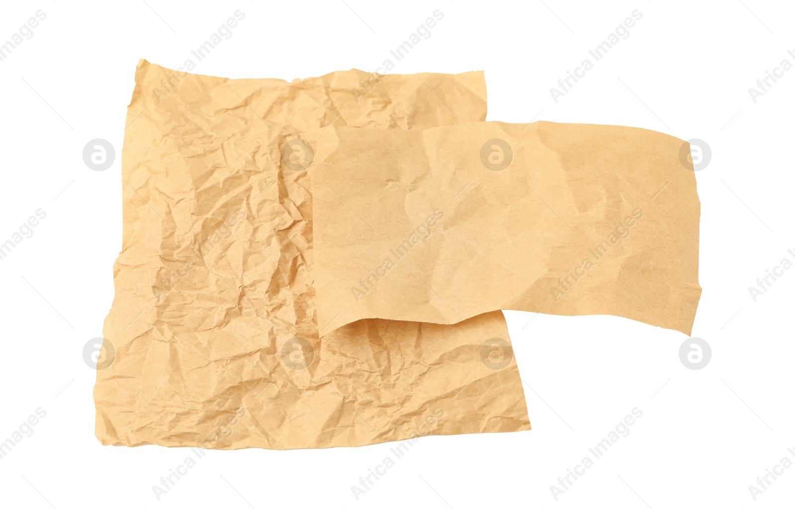 Photo of Crumpled kraft paper sheets isolated on white