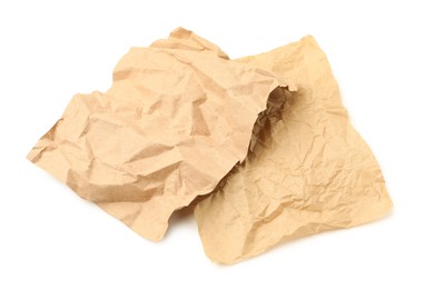 Photo of Crumpled kraft paper sheets isolated on white