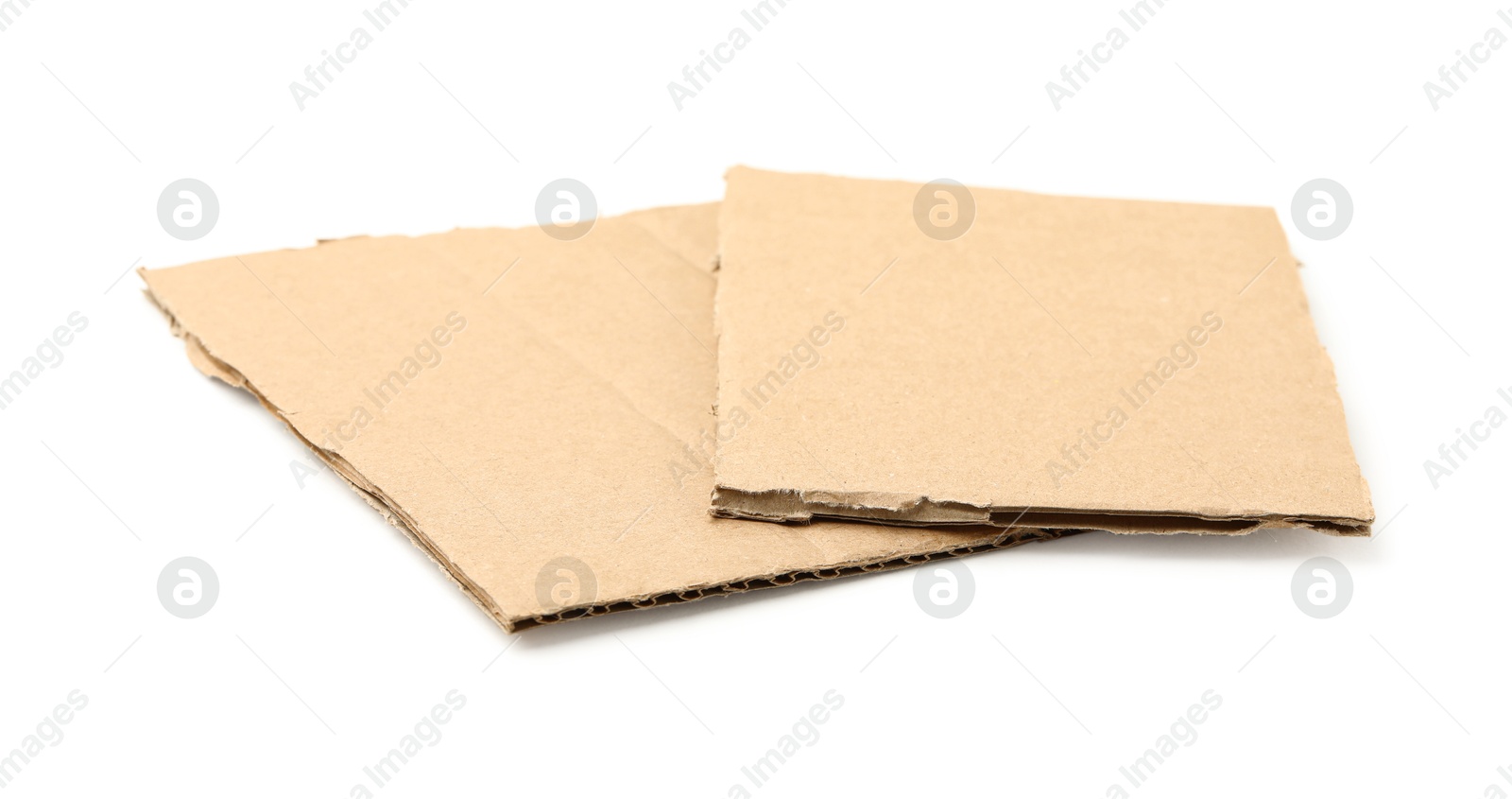 Photo of Pieces of brown cardboard isolated on white