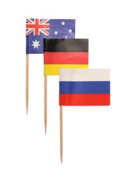 Small paper flags of Russia, Australia and Germany isolated on white