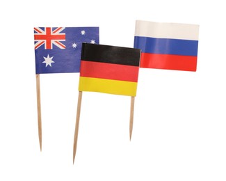 Photo of Small paper flags of Russia, Australia and Germany isolated on white