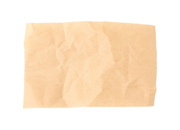 Photo of Crumpled kraft paper sheet isolated on white, top view