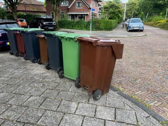 Many color trash bins on city street