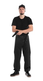 Photo of Young bodyguard with gun isolated on white