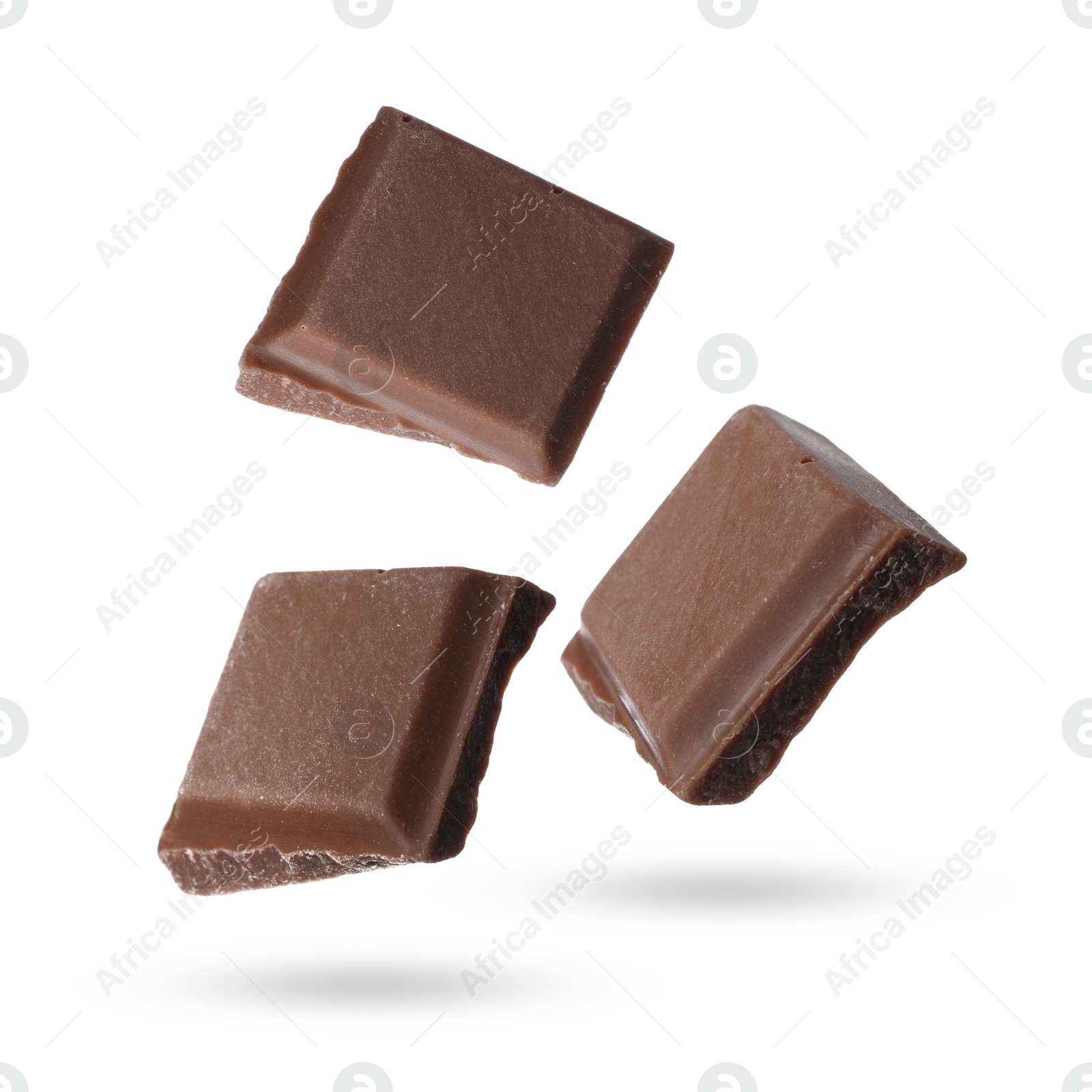 Image of Pieces of sweet chocolate falling on white background