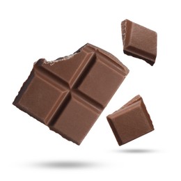 Image of Pieces of sweet chocolate falling on white background