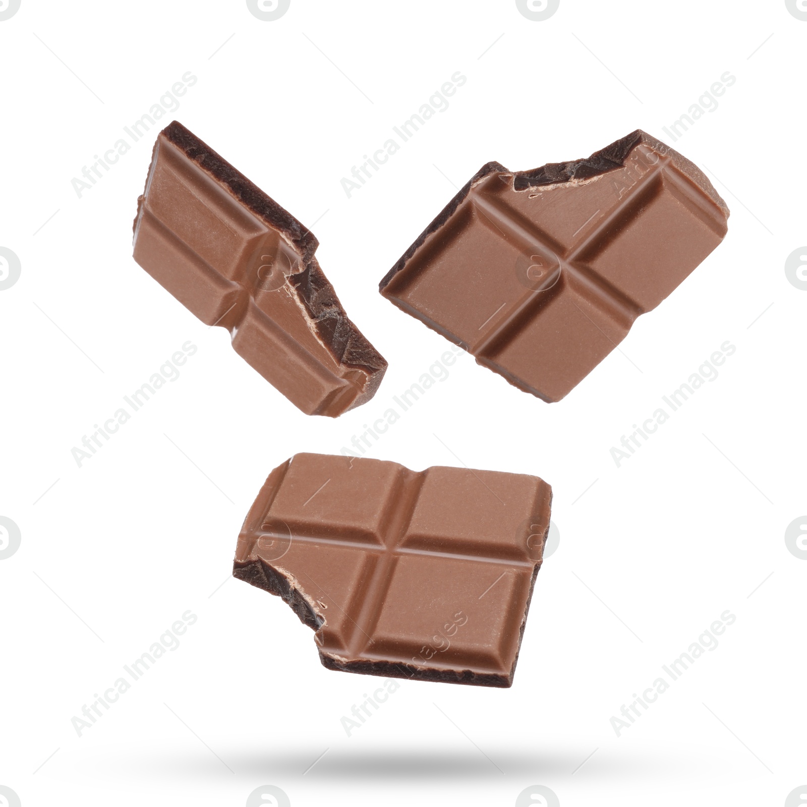 Image of Pieces of sweet chocolate falling on white background