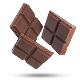 Image of Pieces of sweet chocolate falling on white background