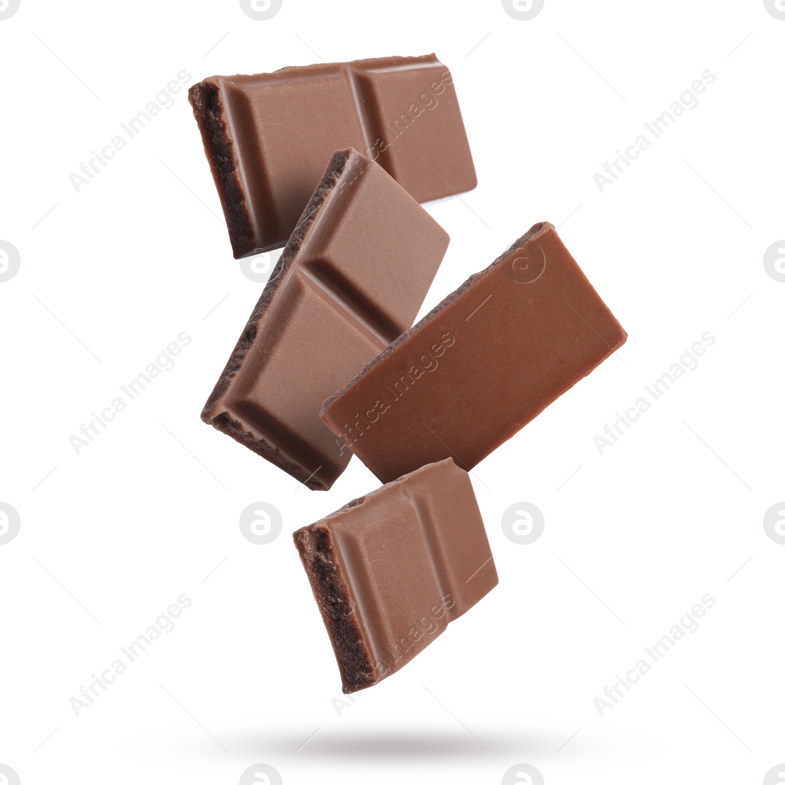 Image of Pieces of sweet chocolate falling on white background